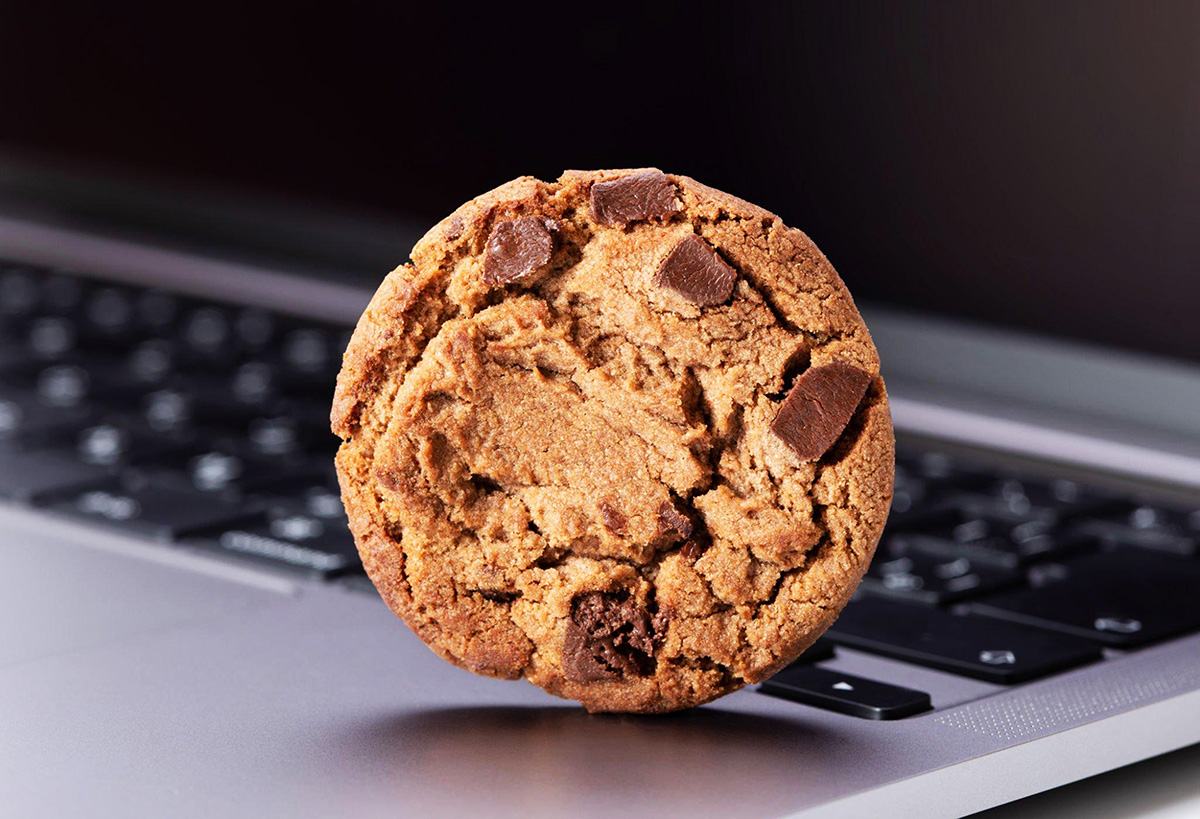 Image of a cookie on top of a laptop
